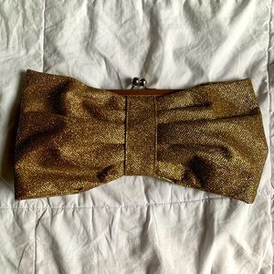 Gold bow shaped clutch